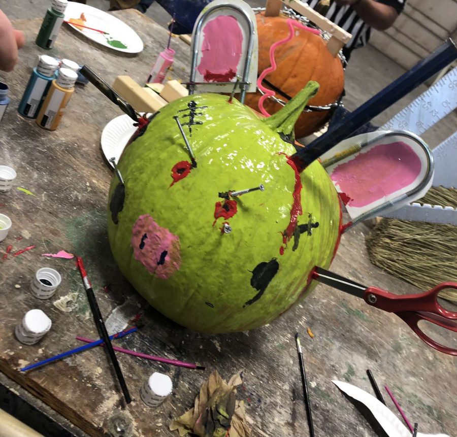 Franken-Pig.+On+Wednesday+night+Delta+FFA+members+gathered+together+to+create+a+monster+pumpkin+out+of+objects+found+throughout+the+Ag+shop.+This+event+took+place+after+the+chapter+meeting.+%E2%80%9COur+initial+plan+was+to+paint+a+zombie+cow+and+then+it+turned+into+a+Frakenstein+pig%2C+which+was+very+humorous+but+I+loved+our+masterpiece%2C%E2%80%9D+said+Arianna+Nelson.