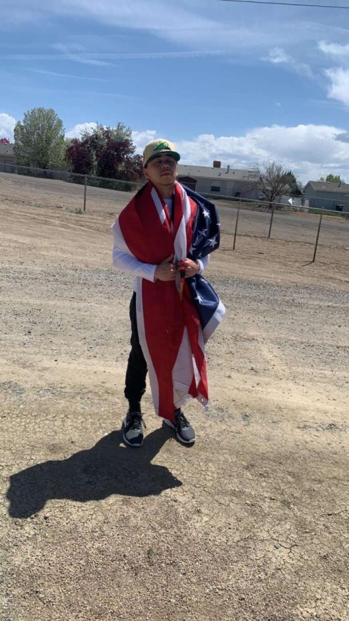 Rodrigo Lopez posing with the American flag.