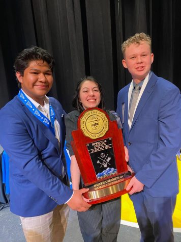 Speech and Debate intep captain Jenna Reece (middle), speaking captain Jesus Trevino (left), and debate captain Nick Serve (right) help their team win team championship in Colorado Springs