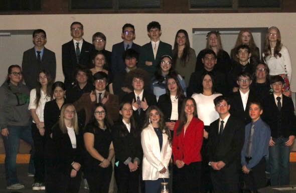 The speech team poses for a picture before their winning sweeps at their home meet on January 11, 2025.
